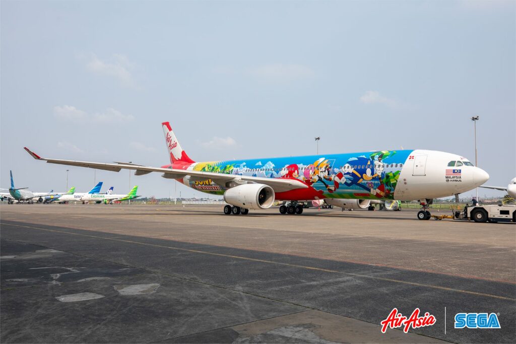 An Air Asia aircraft decorated with Sonic the Hedgehog game imagery as part of a collaboration between AirAsia and SEGA