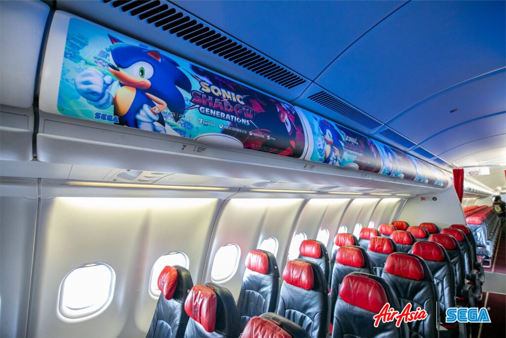 The interior of an Air Asia aircraft decorated with Sonic the Hedgehog game imagery as part of a collaboration between AirAsia and SEGA