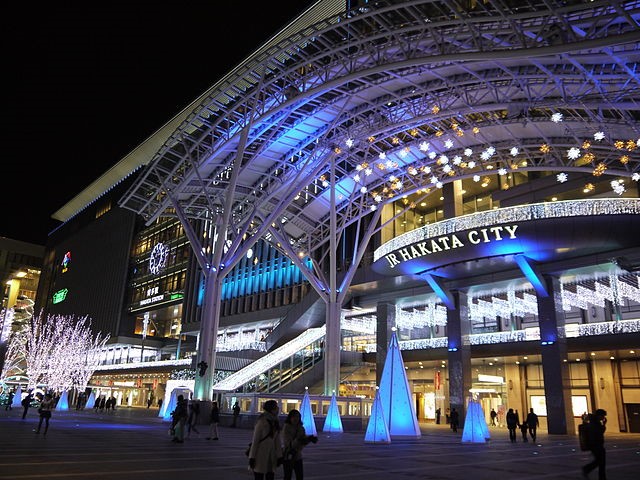 JR Hakata Station illuminated at night