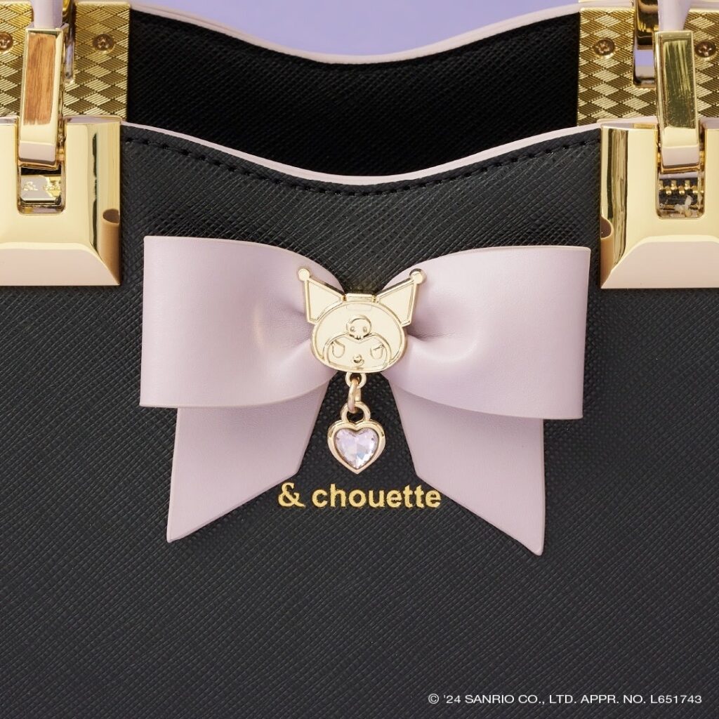 A close up of a ribbon detail on a handbag that is part of the & choutte x kuromi collection.