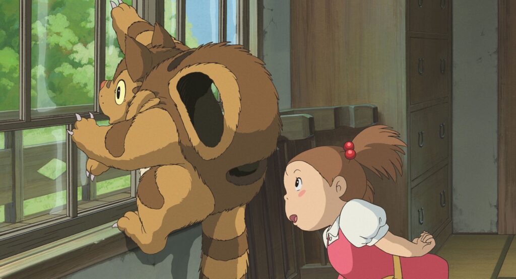 The characters Mei and Baby Catbus in the "film Mei and the Baby Catbus". Baby Catbus is looking out the window, shocked.