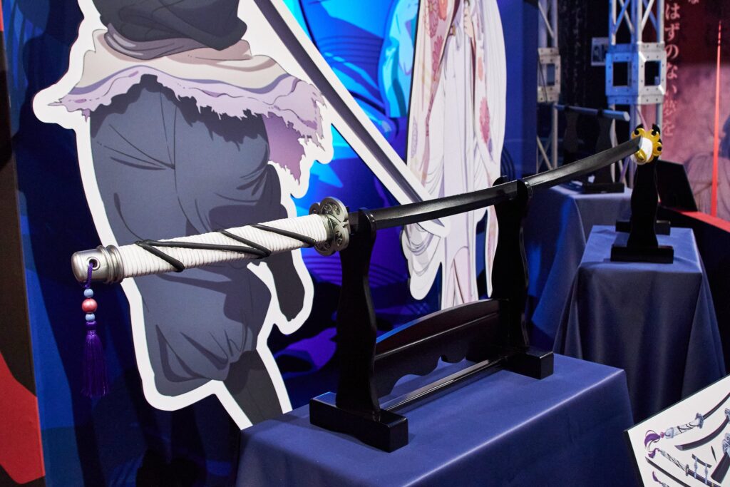 A katana on a stand, part of an exhibition based on the anime Oshi no Ko.