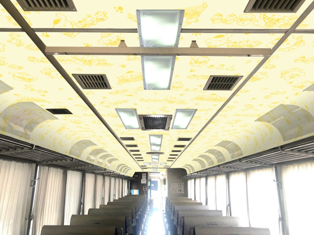 The internal roof of the Pom Pom Purin Tango Outing Train, a train that will operate on the Kyoto Tango Railway for a limited time. The roof is decorated in Pom Pom Purin themed designs.