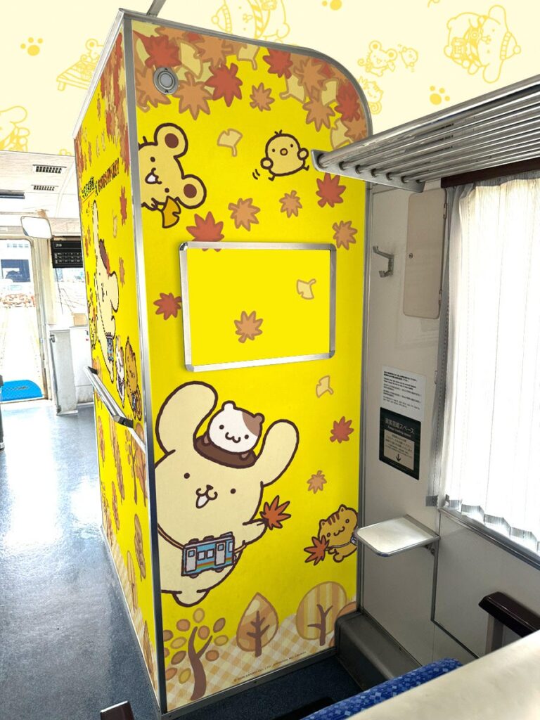 The inside of the Pom Pom Purin Tango Outing Train, a train that will operate on the Kyoto Tango Railway for a limited time. The train is decorated in Pom Pom Purin themed designs.