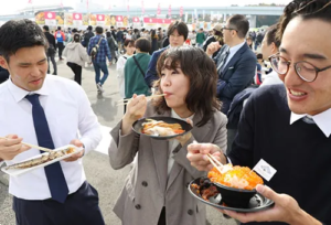 Japanese people enjoying seafood at SAKANA & JAPAN FESTIVAL