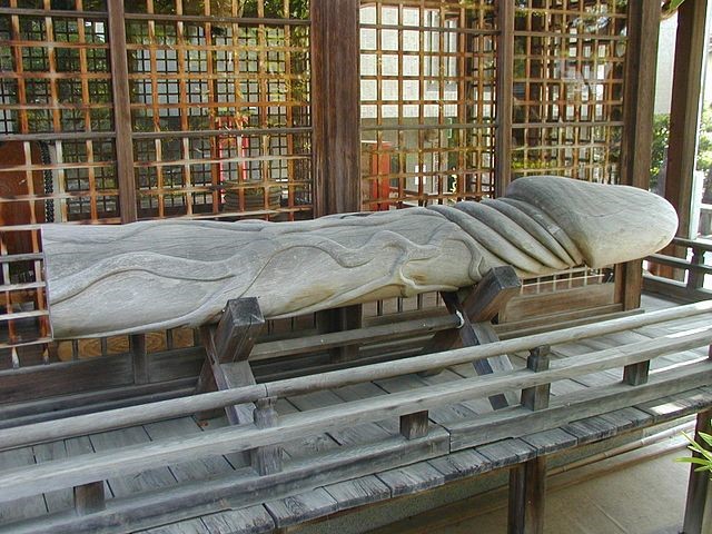 Carved log at Taga Shrine