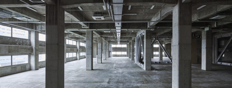 The inside of Terada Warehouse showing concrete pillars and floors.