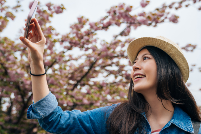 Tourist taking photos with their phone