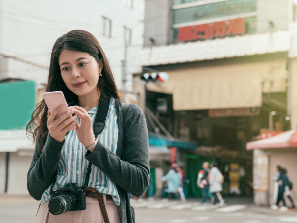 Woman using phone to check location