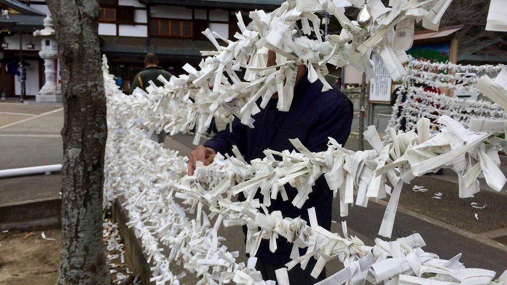 Omikuji tied to a frame