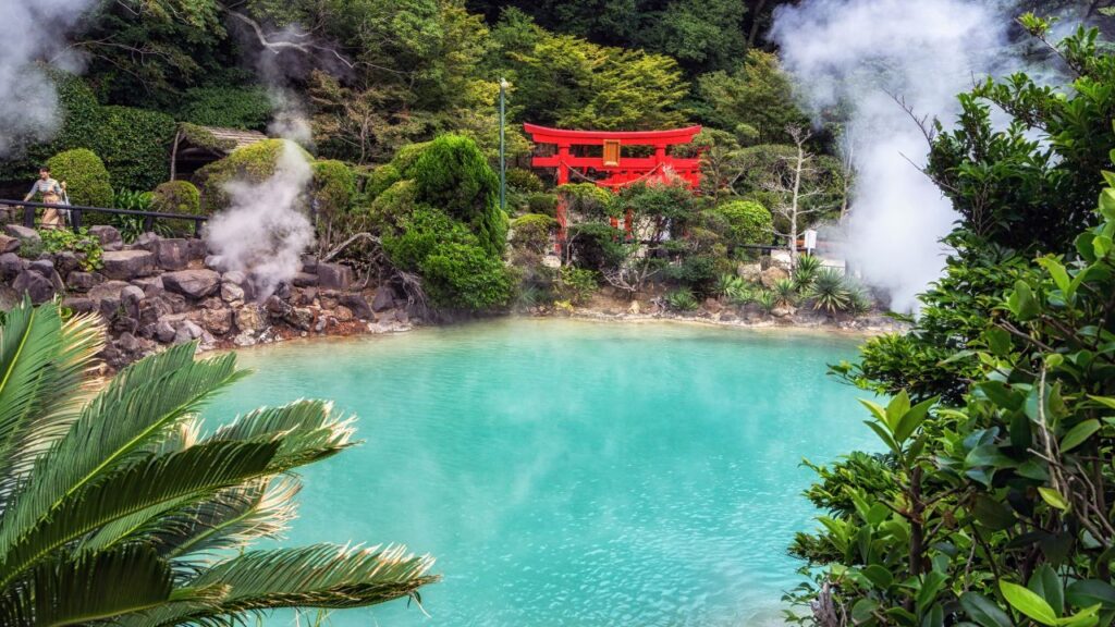 A blue pool of water and steam in Beppu