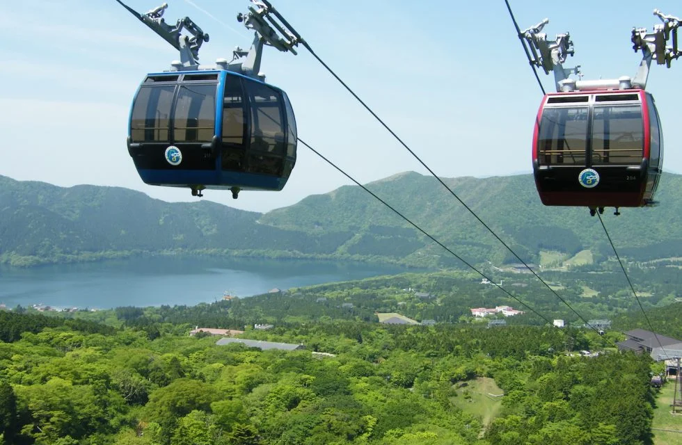 Two gondolas travelling on the Hakone Ropeway in Hakone, Japan