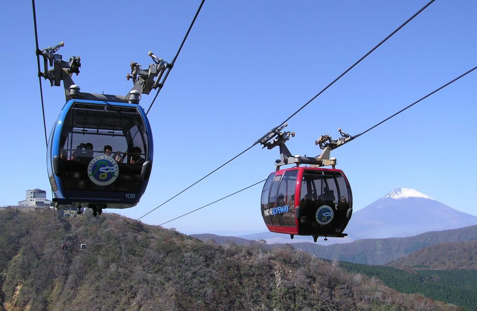 Two gondolas travelling on the Hakone Ropeway in Hakone, Japan