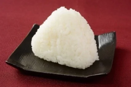 A riceball on a brown plate