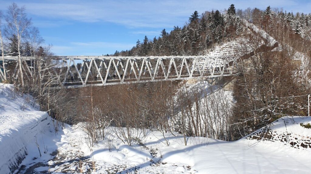 The bridge is a short drive from the pond and meters away from the waterfall