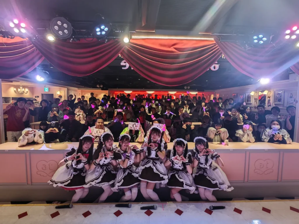 A celebration taking place inside a maid cafe 