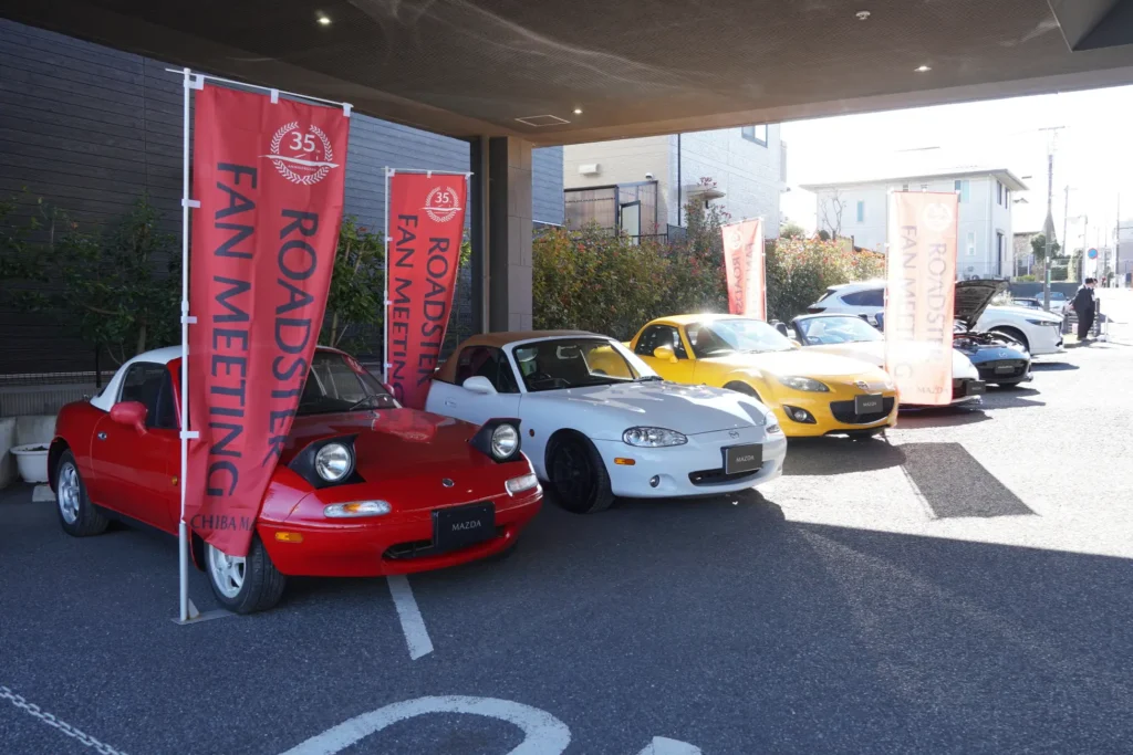 A series of Mazda cars on display