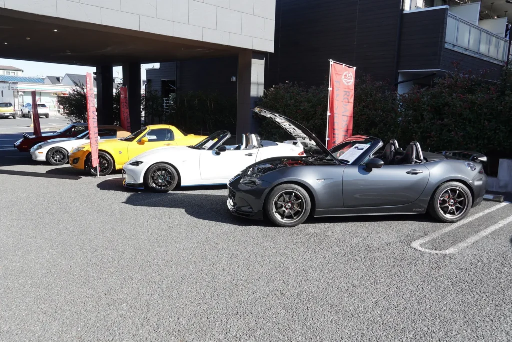 A series of Mazda cars on display