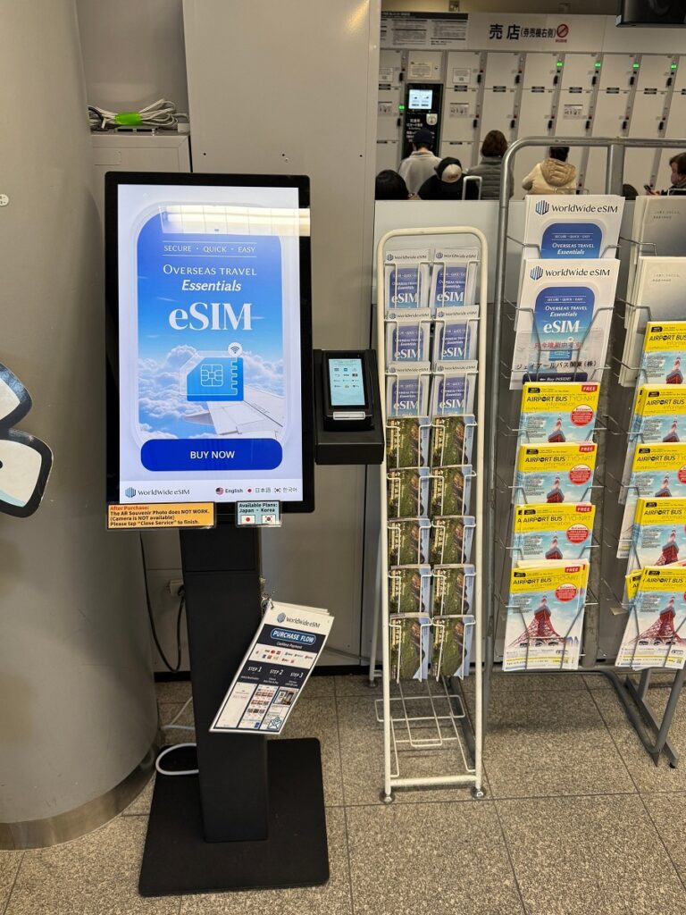 A close-up photograph of the Worldwide eSIM vending machine at Tokyo Station